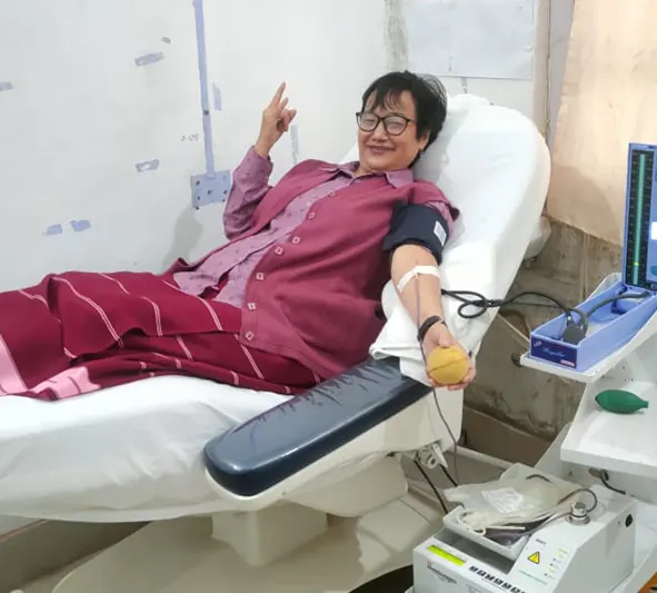 Aini Taloh, founder chairperson of voluntary blood donation organisation AYANG, donating blood for the 45th time at the 