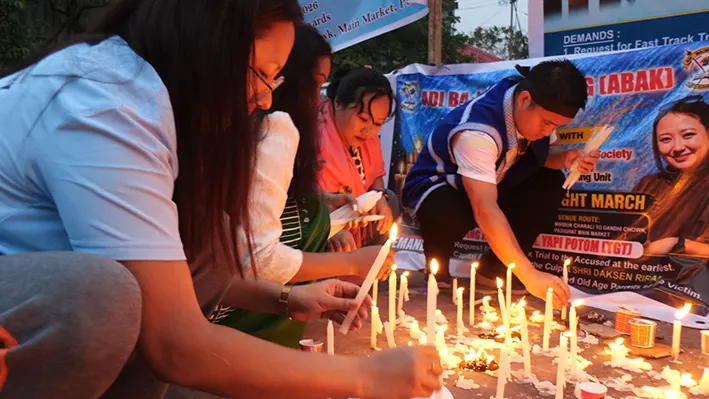 Candlelight march taken out, demanding justice for Yapi Potom