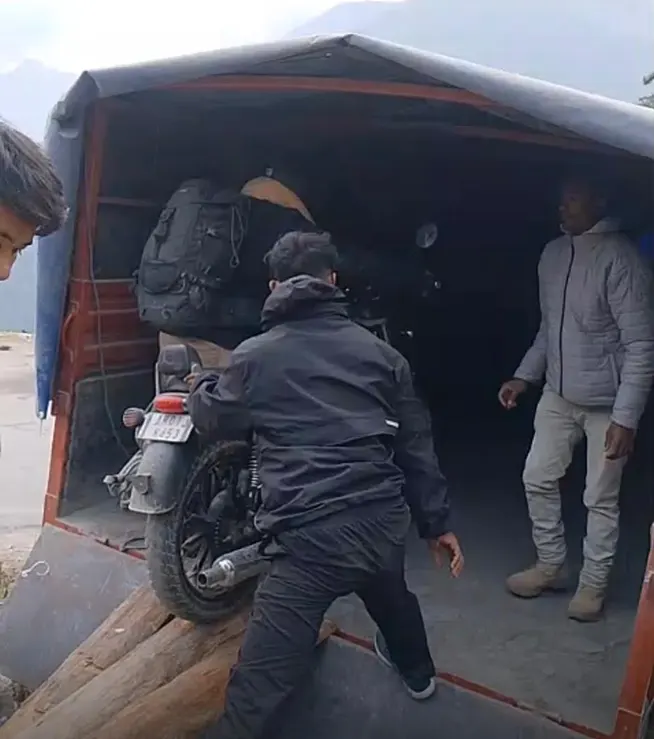 Two-wheelers plying to and from the Roing-Mayudia-Anini road are being loaded onto trucks to cross the tiger-danger zone