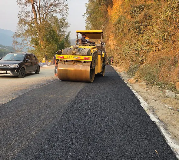 Seppa township road being paved with bituminous concrete